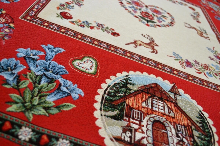 Gobelinowy obrus folkowy 100x100 cm – serca, jelenie i chata na czerwonym tle.